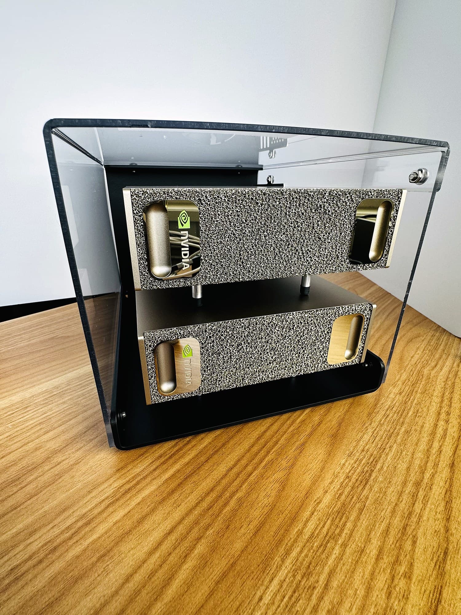Front view of the assembled Stackcooler TP2 showing both DGX Sparks and their NVIDIA logos through the clear cover.